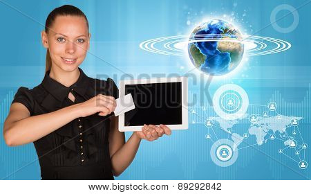 Smiling woman holging tablet and blank card