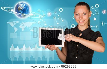 Businesswoman holging tablet and graphical charts