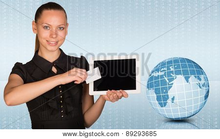 Young woman holging tablet and blank card