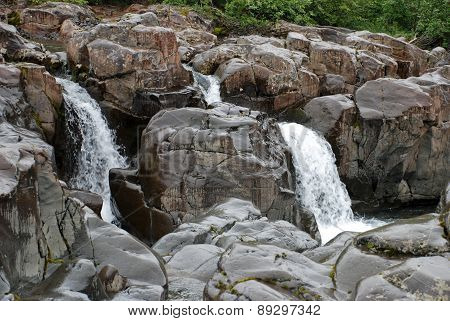Waterfall In The Rocks