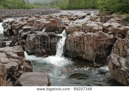 Waterfall In The Rocks
