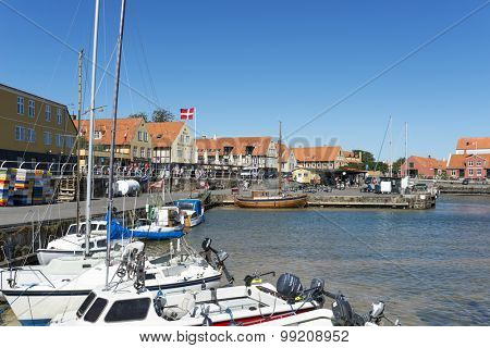 SVANEKE - AUGUST 14 Tourists enjoy the sunny weather and walking along the quay at the port on 14 August 2015 in Svaneke on Bornholm Island, Denmark.