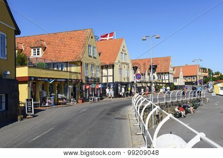 SVANEKE - AUGUST 14: Tourists enjoy the sunny weather and walking through the old town on 14 August 2015 in Svaneke on Bornholm Island, Denmark.