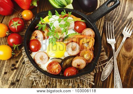 Fried Eggs With Vegetables And Sausage
