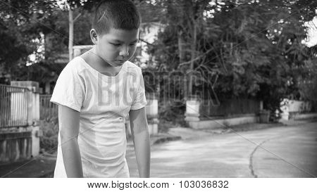 An Asian boy scared and alone