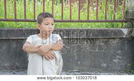An Asian boy scared and alone