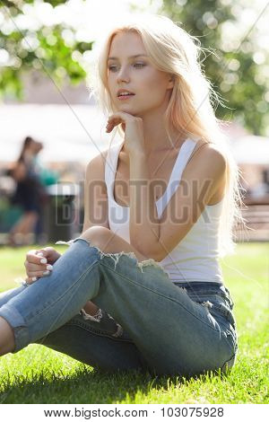 Beautiful young blond girl outdoors