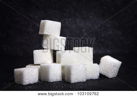 Cloose Up White Sugar Cubes On Black Stone Plate Background