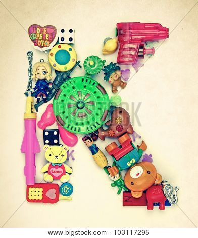 the letter    K made from small toys