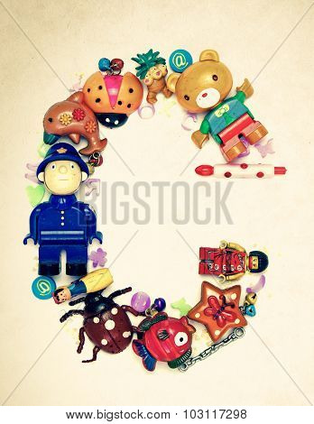 the letter C made from small toys