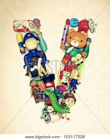 the letter     V  made from small toys