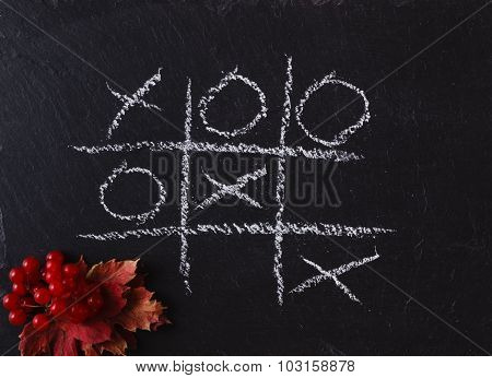 Game Tic Tac Toe On Black Slate Board