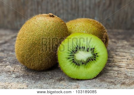 Close Up Fresh Kiwi Fruit On Old Wood Background.
