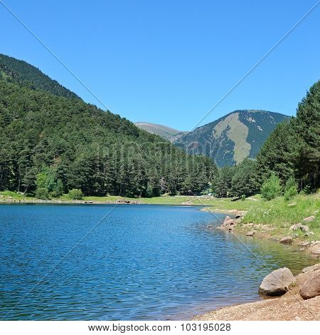 Picturesque Lake, Mountains And Blue Sky