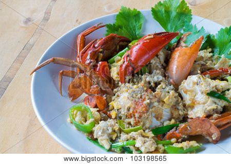 The chilli crab, fried eggs decorated with parsley seafood.
