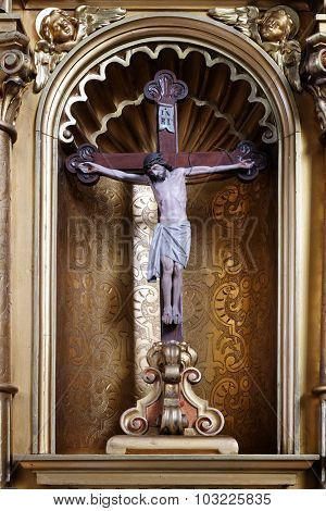 ZAGREB, CROATIA - MAY 28: Cross on the altar in the Basilica of the Sacred Heart of Jesus in Zagreb, Croatia on May 28, 2015