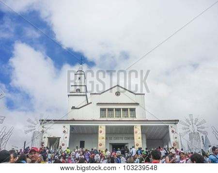 People And Monserrate Basilica In The City Of Bogota Colombia
