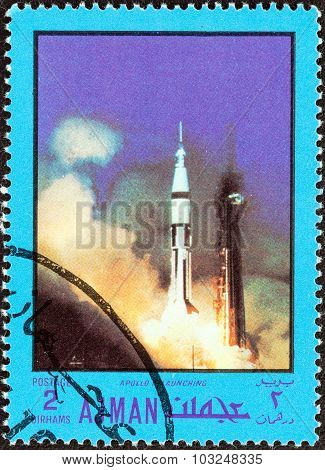 AJMAN EMIRATE - CIRCA 1970: Stamp shows Apollo VII launching