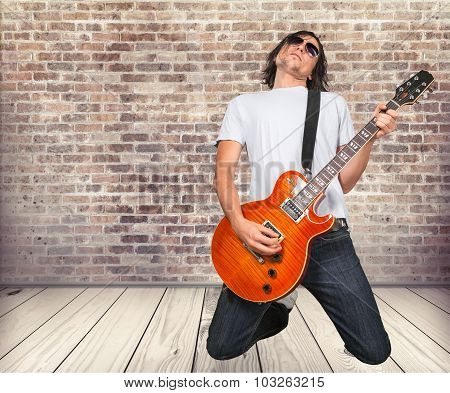 Playing guitar.