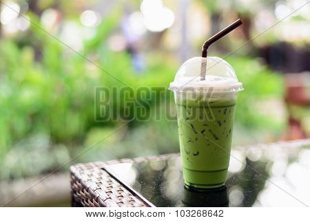 Matcha Green Tea Latte Clod  On Wooden Table Background