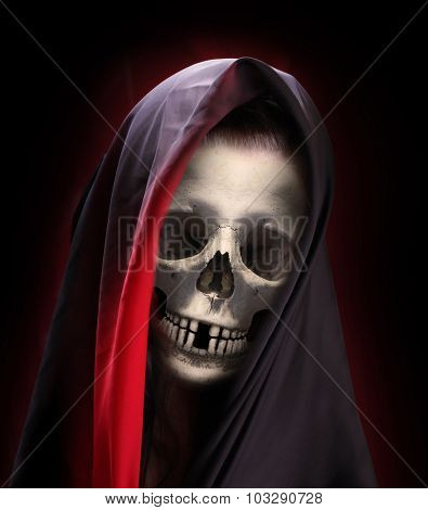 Portrait of death. Skeleton with smiling skull  dressed in veil or burka. 