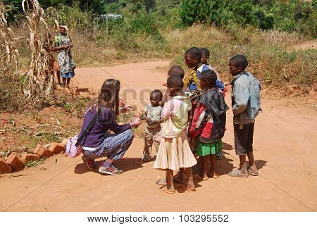 August 8,, 2014, Mountain of Kilolo-Kilolo-Tanzania-Africa-An unidentified female doctor while talking to a group of unidentified African children in the area of Kilolo where medical care arriving only through volunteering of international NGOs