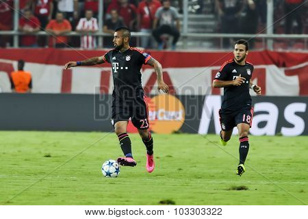 Arturo Vidal (l) And Juan Bernat (r) During The Uefa Champions League Game Between Olympiacos And Ba