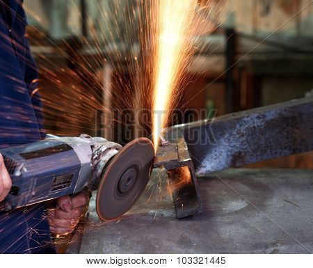 Using an angle grinder.
