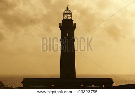 Lighthouse At Sunset In Faial Island. Ponta Dos Capelinhos. Azores