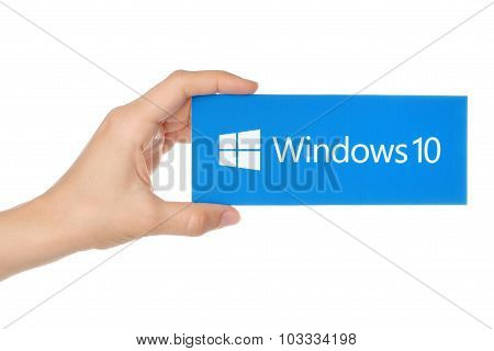 Hand holds Windows 10 logotype printed on paper