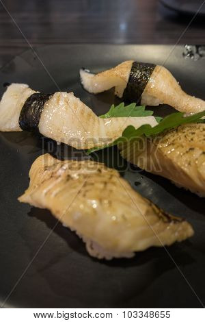 Assorted Japanese Sushi on black ceramic plate