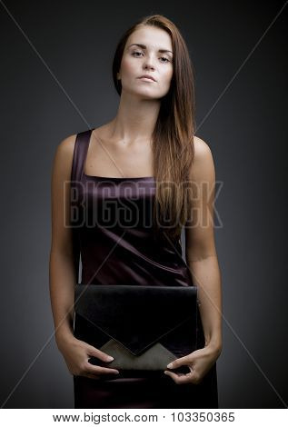 Elegant, Beautiful Woman With Clutch Bag