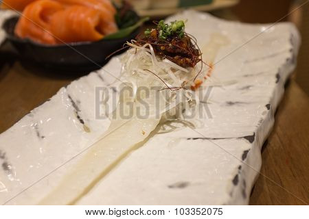 Engawa Sushi with Miso on White ceramic plate