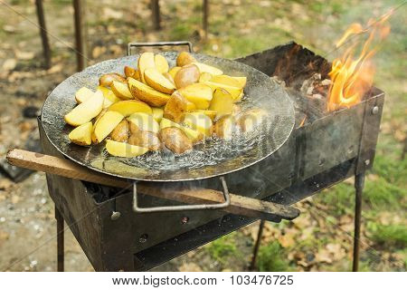 Fried Potato In Big Melal Pot.