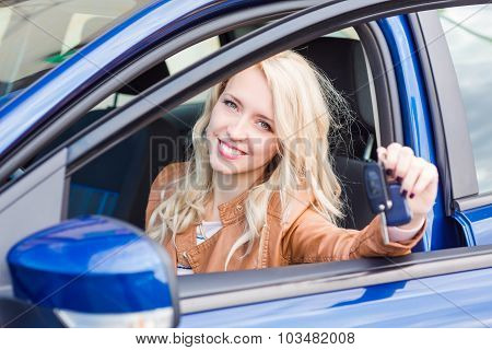 Beautiful Happy Young Girl Sitting In The Car
