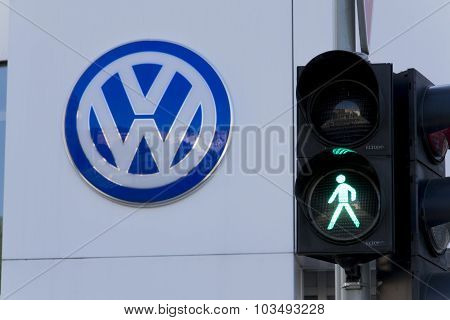 Green Colour On Traffic Light With Volkswagen Car Maker Logo