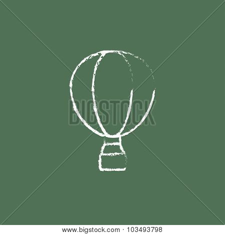 Hot air hand drawn in chalk on a blackboard vector white icon isolated on a green background.
