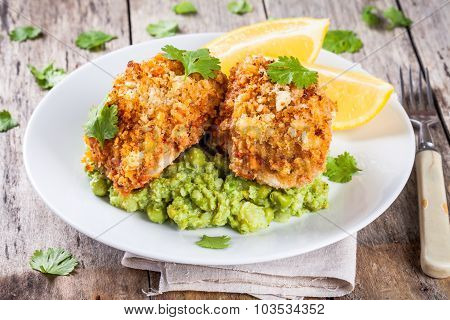 Baked Cod Fish In Breadcrumbs With Mashed Green Peas And Broccoli