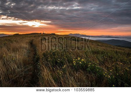 Hiker Greets Sun rise In The Blue Ridge Mountains
