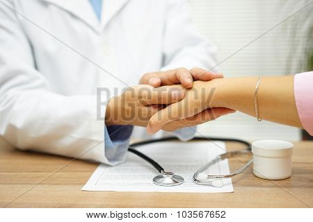 Doctor Holding Patient Hand With Compassion And Comfort