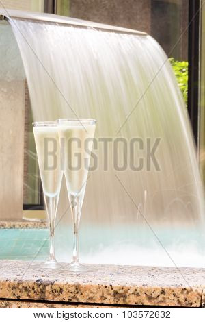 Two Glasses Of Champagne Near Outdoor Jacuzzi