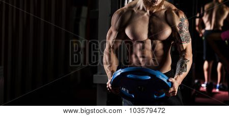 Powerlifter With Strong Arms Lifting Weights