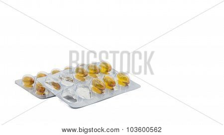 Yellow food supliment tablet with white background
