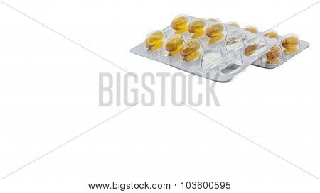 Yellow food supliment tablet with white background