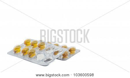 Yellow food supliment tablet with white background