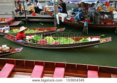 RATCHABURI THAILAND - JULY 5: Fruit boats at Damnoen Saduak floating market on July 5 2009 in Ratcha