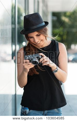 The Smiling Student Photographs With Digital Mirrorless Camera.