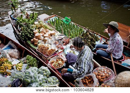 RATCHABURI THAILAND - AUGUST 28: Food boats at Damnoen Saduak floating market on August 28 2010 in R