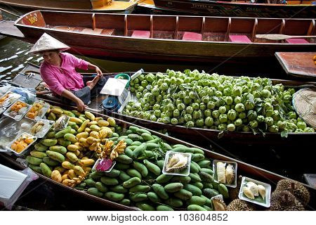 RATCHABURI THAILAND - AUGUST 28: Fruit boats at Damnoen Saduak floating market on August 28 2010 in