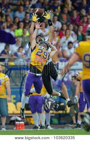 VIENNA, AUSTRIA - JULY 13, 2014: B Andreas Lunzer (#29 Vikings) reaches for the ball during an Austrian football league game.
